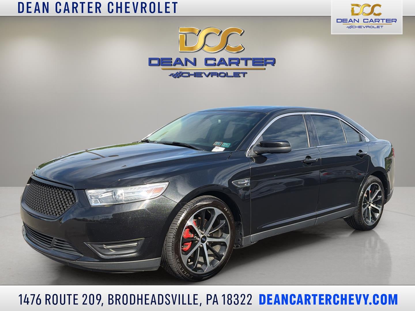 2014 Ford Taurus SEL in Black — front three-quarter view