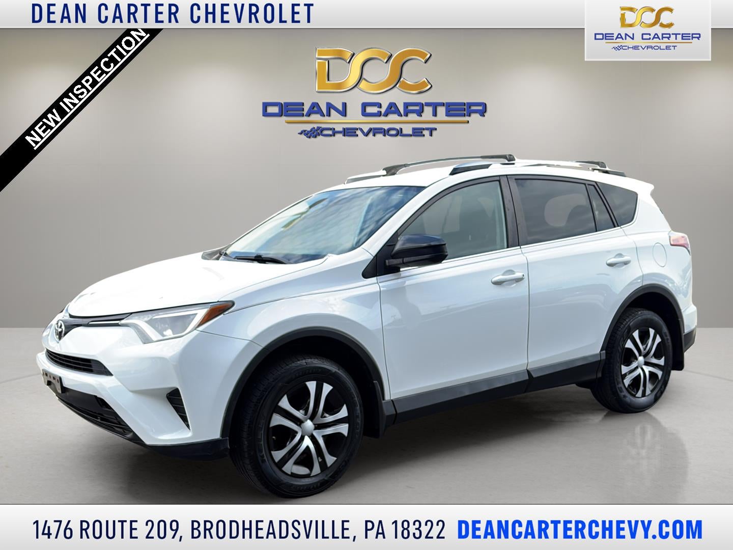 2016 Toyota RAV4 LE in White — front three-quarter view