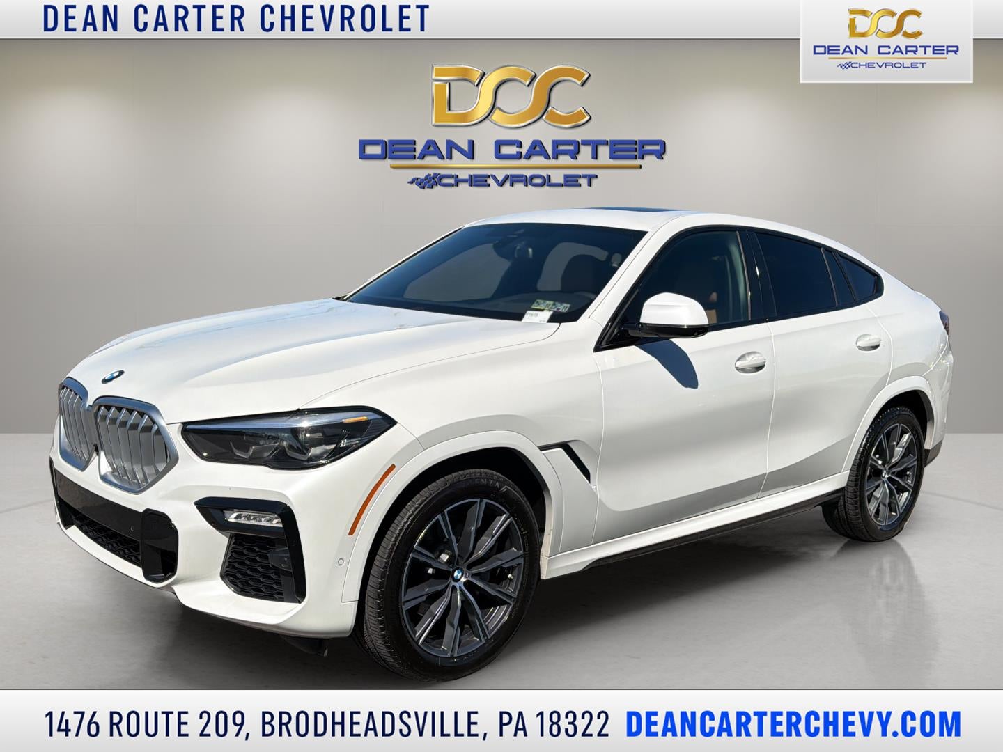 2021 BMW X6 xDrive40i in White — front three-quarter view